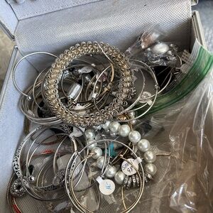 Bag of bracelets, rings and earrings